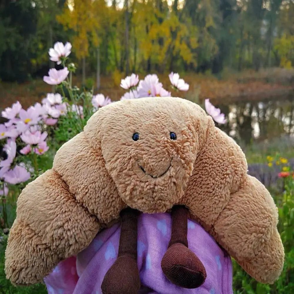 Croissnuggle™ – Lachende croissant knuffel – Pluche knuffel