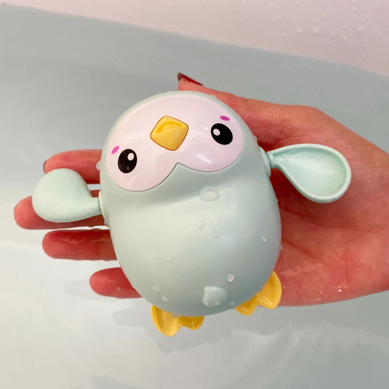SwimSpinny™ – Opwindbaar Dierenspeeltje voor in Bad – Drijvend Badspeelplezier