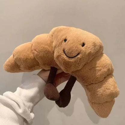Croissnuggle™ – Lachende croissant knuffel – Pluche knuffel